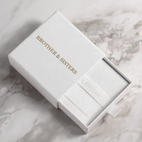 Thumbnail for Love Photo Necklace in elegant Brother & Sisters packaging on a marble surface.