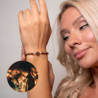 Thumbnail for A woman wearing a Metallic Photo Bracelet featuring a cherished photo, showcasing style and sentiment by Brother & Sisters.