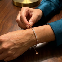 Thumbnail for Adjusting the extension chain of the rose gold Crystal Bar Bracelet on the wrist