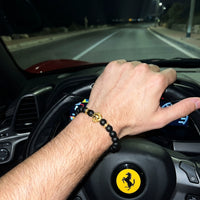 Thumbnail for Gold Lion & Black Stones Bracelet – worn at the steering wheel of a luxury car | Brother & Sisters | SKU: 20712286-gold-XS-14-15, 20712286-gold-S-16-17, 20712286-gold-M-18-19, 20712286-gold-L-20-21, 20712286-gold-XL-22-23