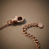 Thumbnail for Close-up of the lobster clasp and extension chain of the rose gold Crystal Bar Bracelet