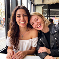 Thumbnail for Two best friends laughing together, one wearing the silver secret heart photo necklace | SKU: TPH-CHTN-SILVER-SMALL