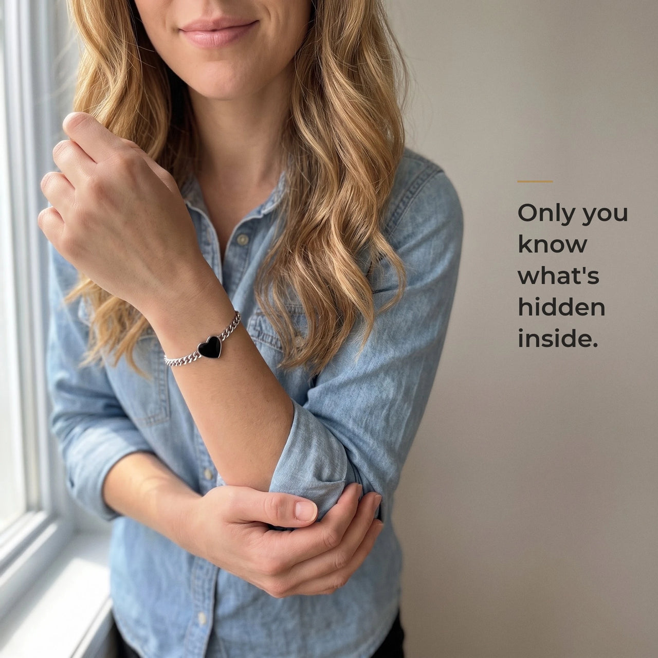 Woman wearing the silver bracelet with its black heart charm, only she knows the photo inside | SKU: TPH-HRTB-SILVER