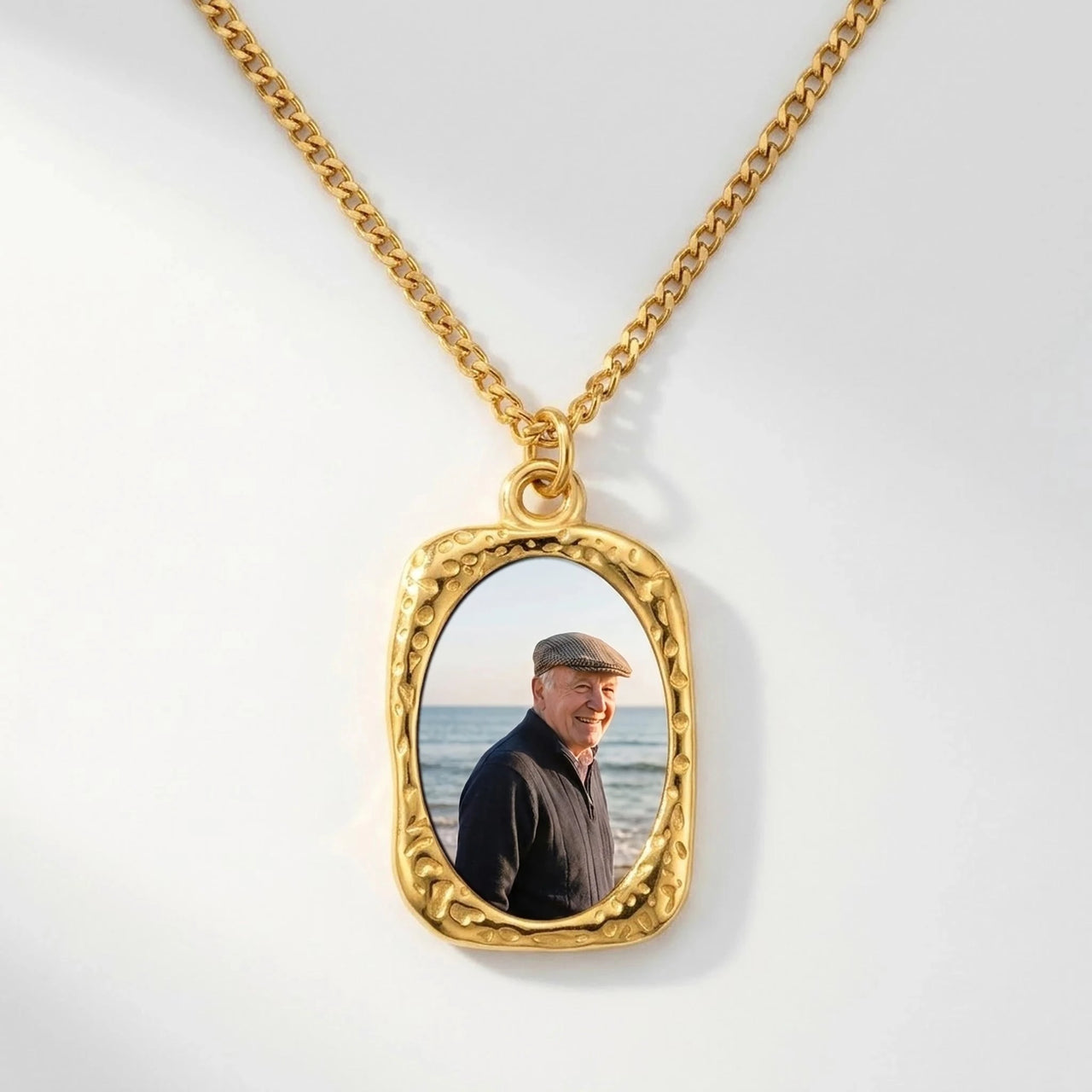 Secret Oval Photo Necklace in gold, black oval pendant turning into a hidden photo when warmed | SKU: TPH-OVLN-GOLD