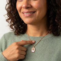 Thumbnail for Woman moved as she looks at her late father's photo in the rose gold oval necklace | SKU: TPH-OVLN-ROSEGOLD