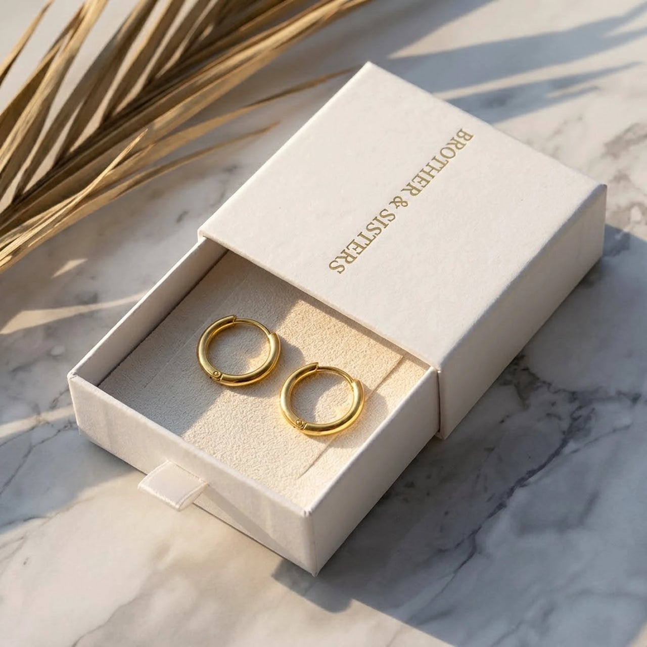 Tiny Huggie Hoops in Gold, in the gift box | SKU: 41002-gold